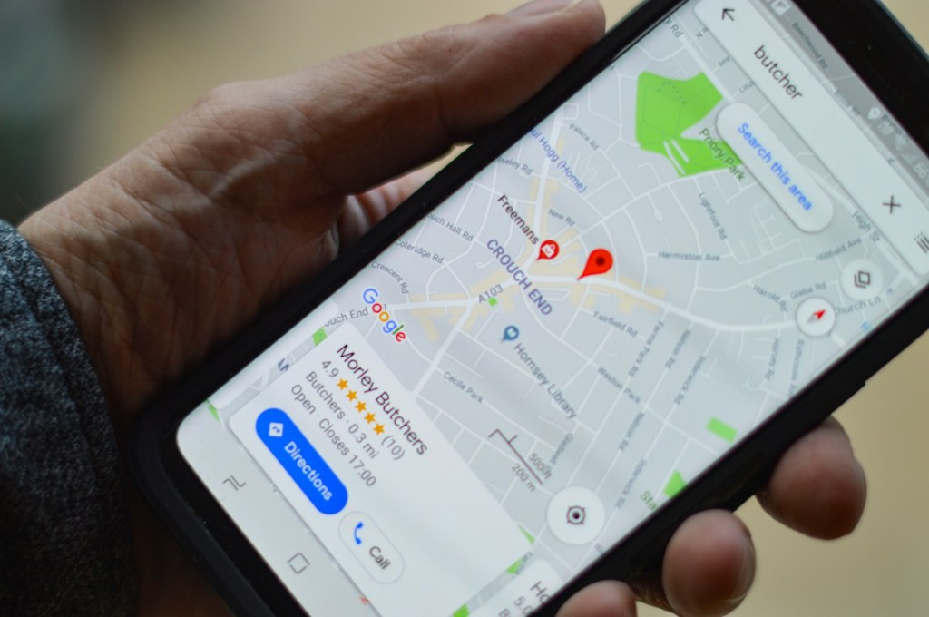 Phone showing a Google Maps search for local businesses.