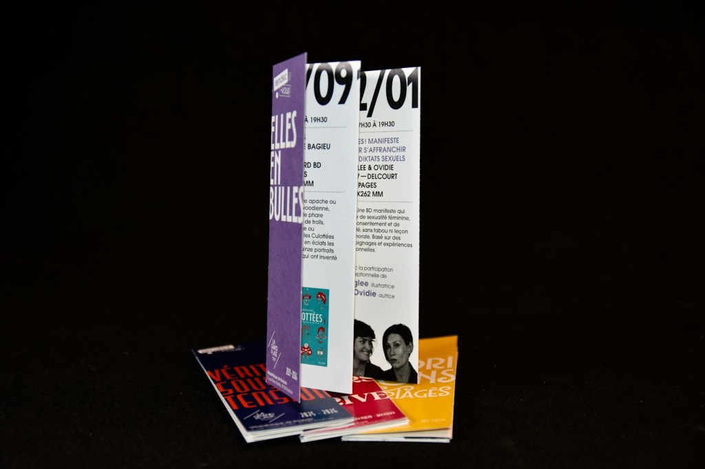 Stack of printed leaflets ready for distribution.